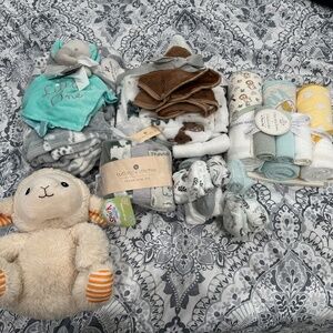 Newborn towels, blankets, washcloths and a toy